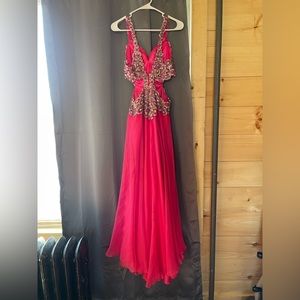 Never worn size 6 hot pink prom dress with cut out back and sides